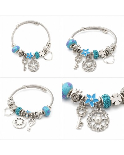 Turkuaz Mavi Charm Detaylı Gümüş Renk Kadın Bileklik – 6 cm Hediye Keseli Turkuaz Mavi Charm Detaylı Gümüş Renk Kadın Bileklik – 6 cm Hediye Keseli